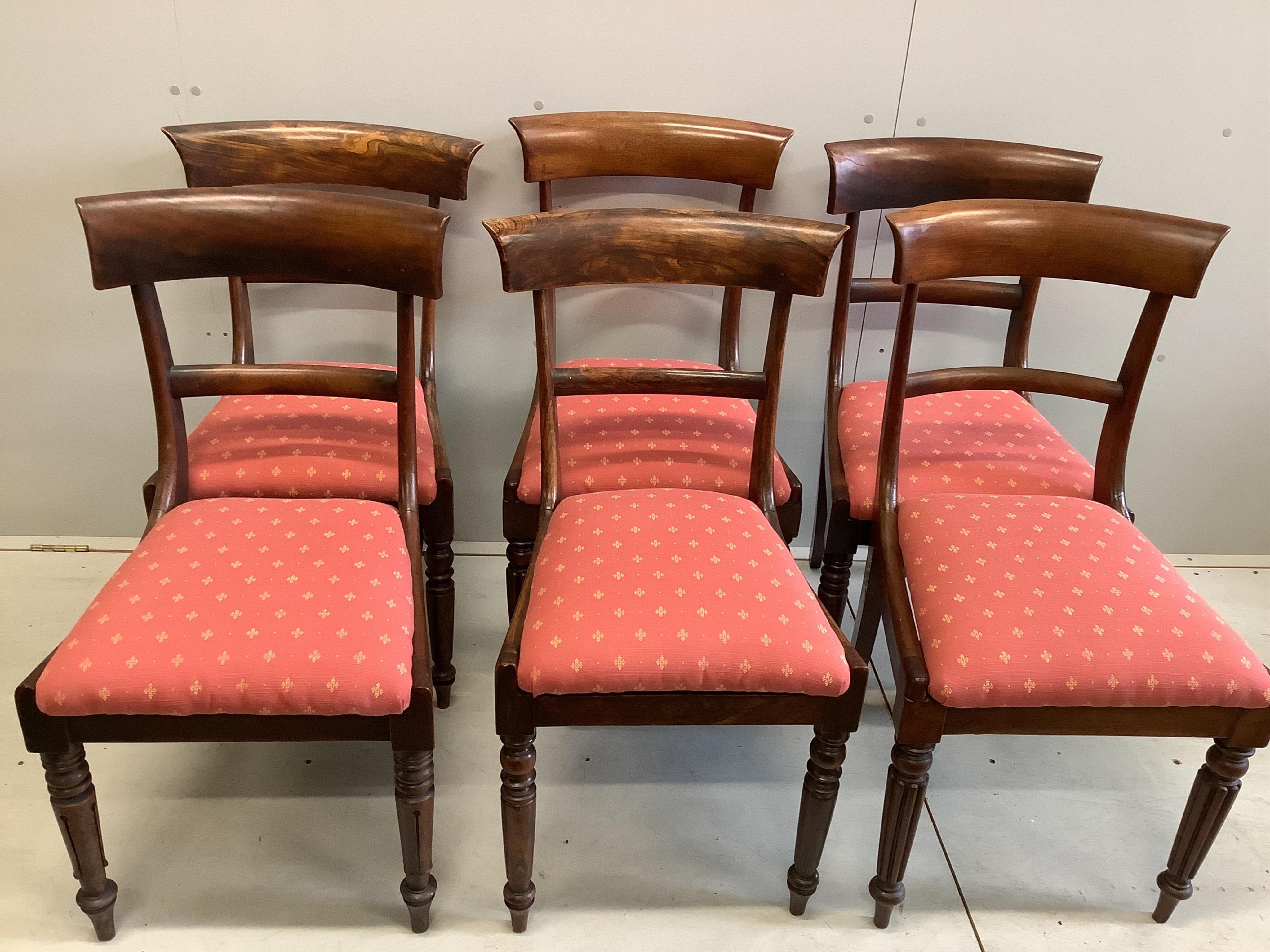 A Victorian circular mahogany tilt top breakfast table, diameter 118cm, height 77cm together with a harlequin set of six William IV mahogany and simulated rosewood dining chairs. Condition - fair